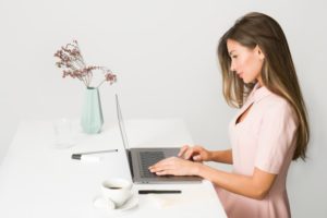 woman working on her faith statement for job application